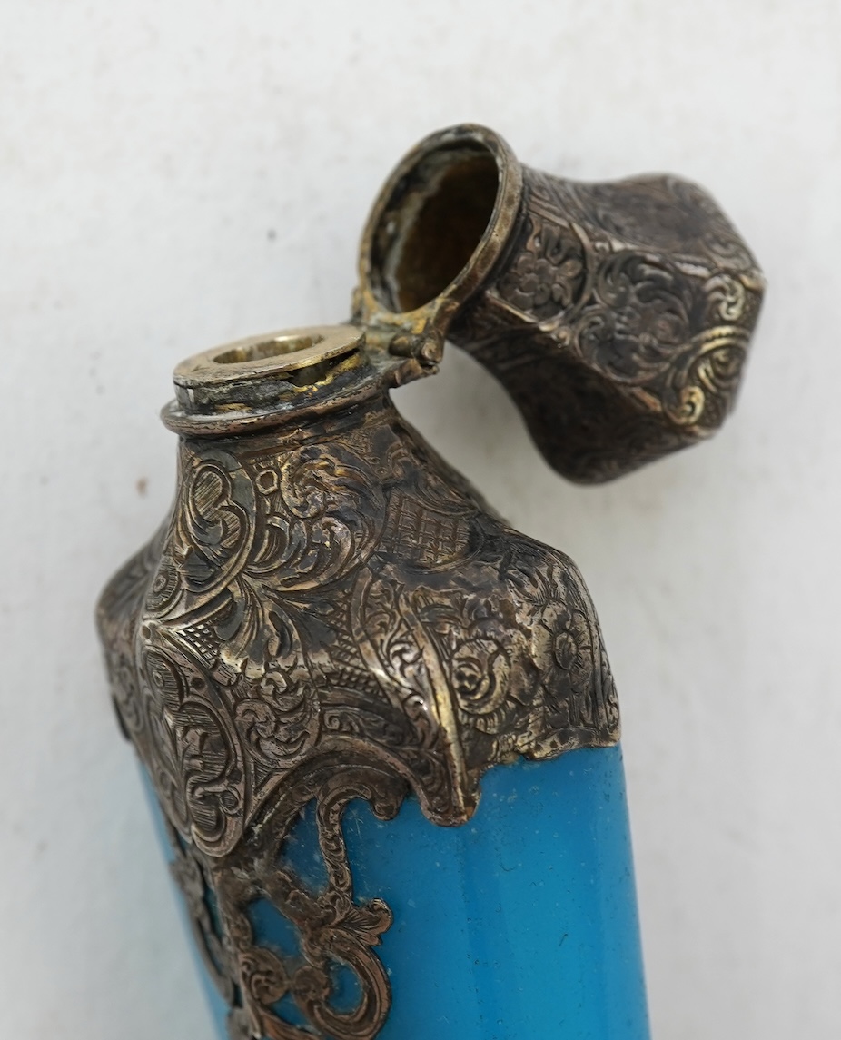 A late 19th century French white metal mounted and overlaid blue opaline glass scent flask